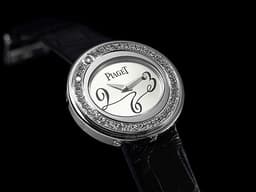 PIAGET 伯爵 Possession P10402 18K白金材質 <font color="#05f0f0">原廠鑲嵌鑽石旋轉錶圈</font> 石英機芯&nbsp;29mm